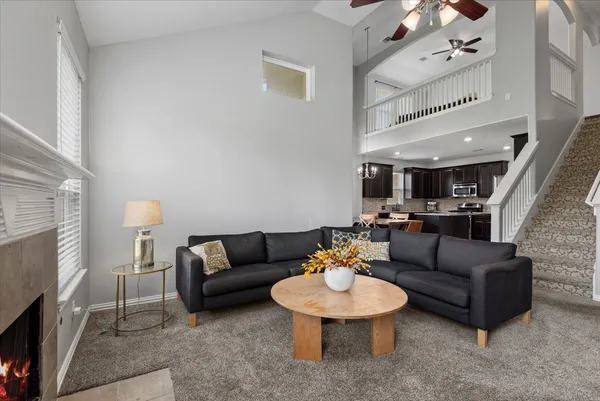 a living room with furniture and a fireplace