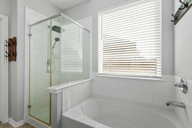 a white bath tub sitting next to a window