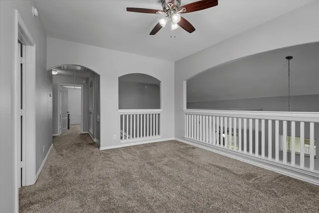 a view of a hallway to a bedroom