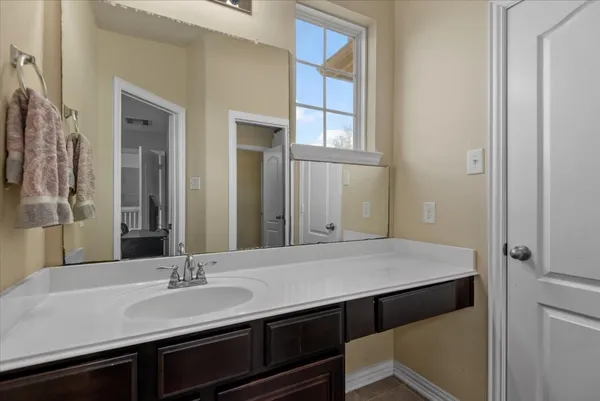 a bathroom with a sink and a mirror