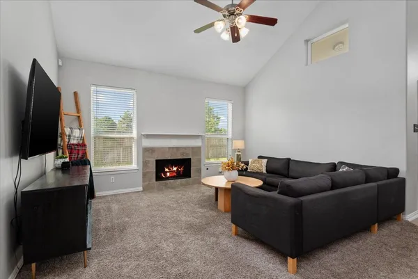 a living room with furniture and a flat screen tv
