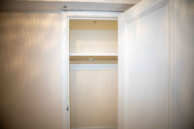 a white stove top oven sitting inside of a kitchen