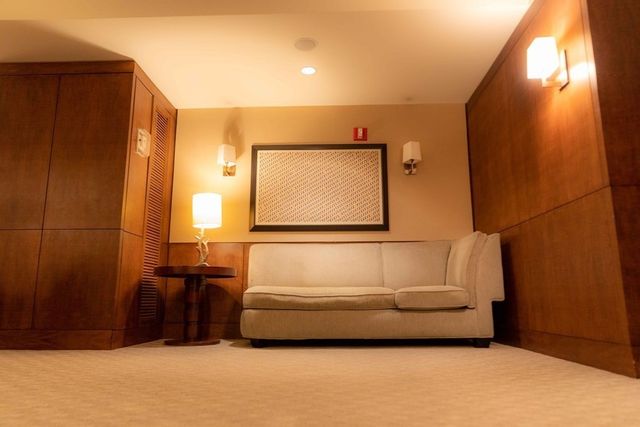 a view of a livingroom with furniture and a flat screen tv