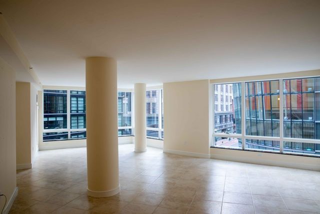 a view of an empty room with glass door
