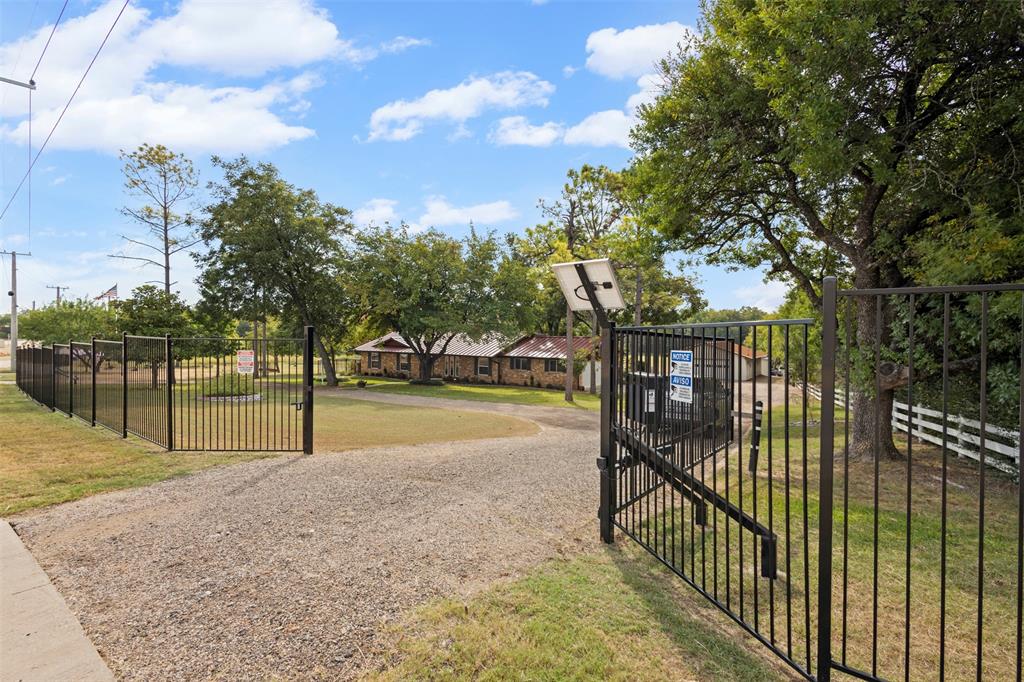 1009 West Interstate 20 Grand Prairie, TX 75052 - Photo 19 of 40 a view of swimming pool with deck and trees