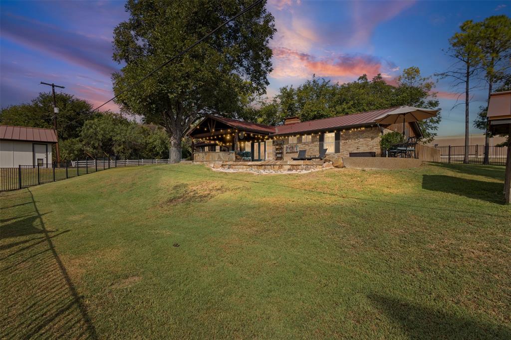 1009 West Interstate 20 Grand Prairie, TX 75052 - Photo 22 of 40 a view of house with outdoor space and garden