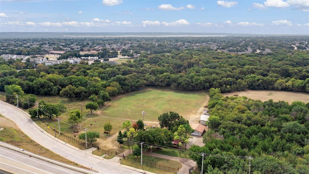 1009 West Interstate 20 Grand Prairie, TX 75052 - Photo 30 of 40 an aerial view of residential houses with outdoor space and lake view