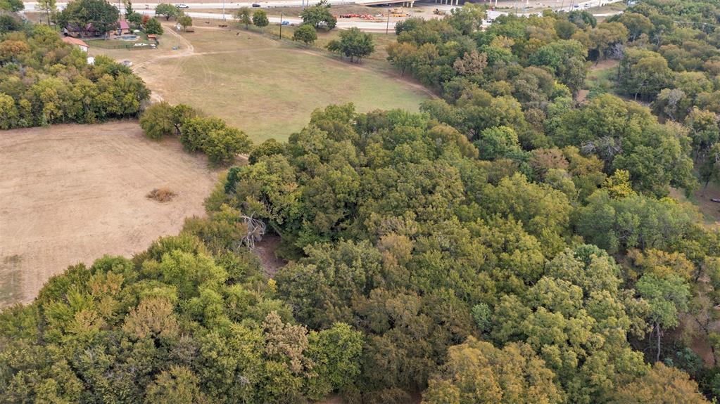 1009 West Interstate 20 Grand Prairie, TX 75052 - Photo 34 of 40 a view of a field of grass and trees
