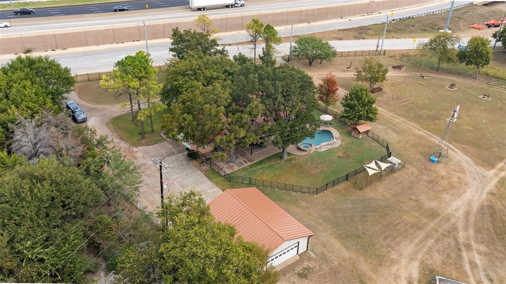 1009 West Interstate 20 Grand Prairie, TX 75052 - Photo 37 of 40 a backyard of a house with a yard and outdoor seating