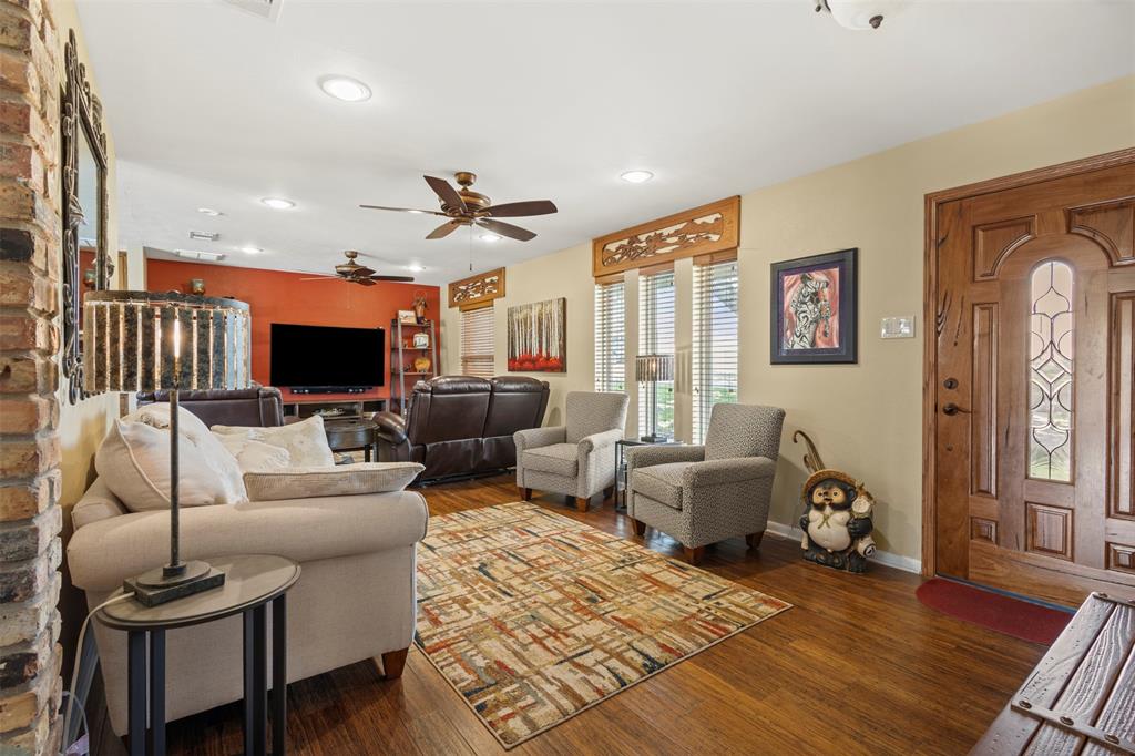 1009 West Interstate 20 Grand Prairie, TX 75052 - Photo 6 of 40 a living room with furniture a flat screen tv and a window