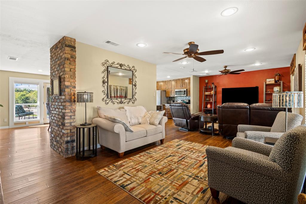 1009 West Interstate 20 Grand Prairie, TX 75052 - Photo 9 of 40 a living room with furniture and wooden floor