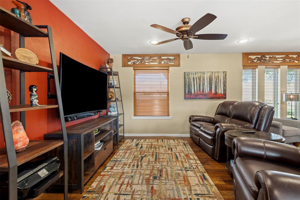 1009 West Interstate 20 Grand Prairie, TX 75052 - Photo 9 of 40 a living room with furniture and a flat screen tv