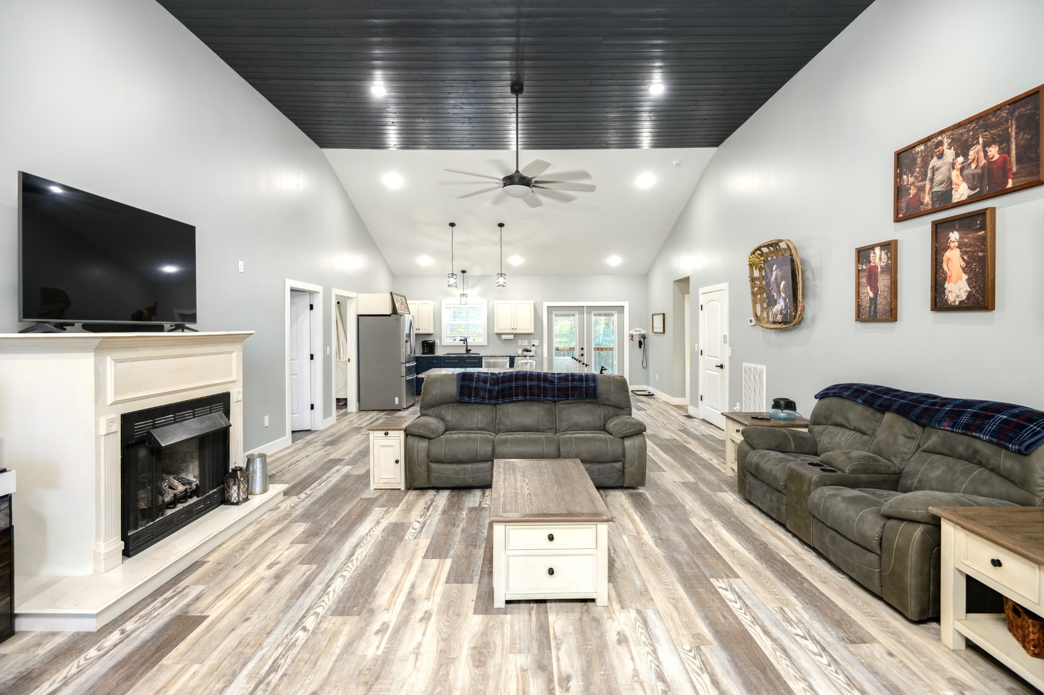 838 Old W Point Road Smithville, TN 37166 - Photo 18 of 65 a living room with furniture a flat screen tv and a fireplace