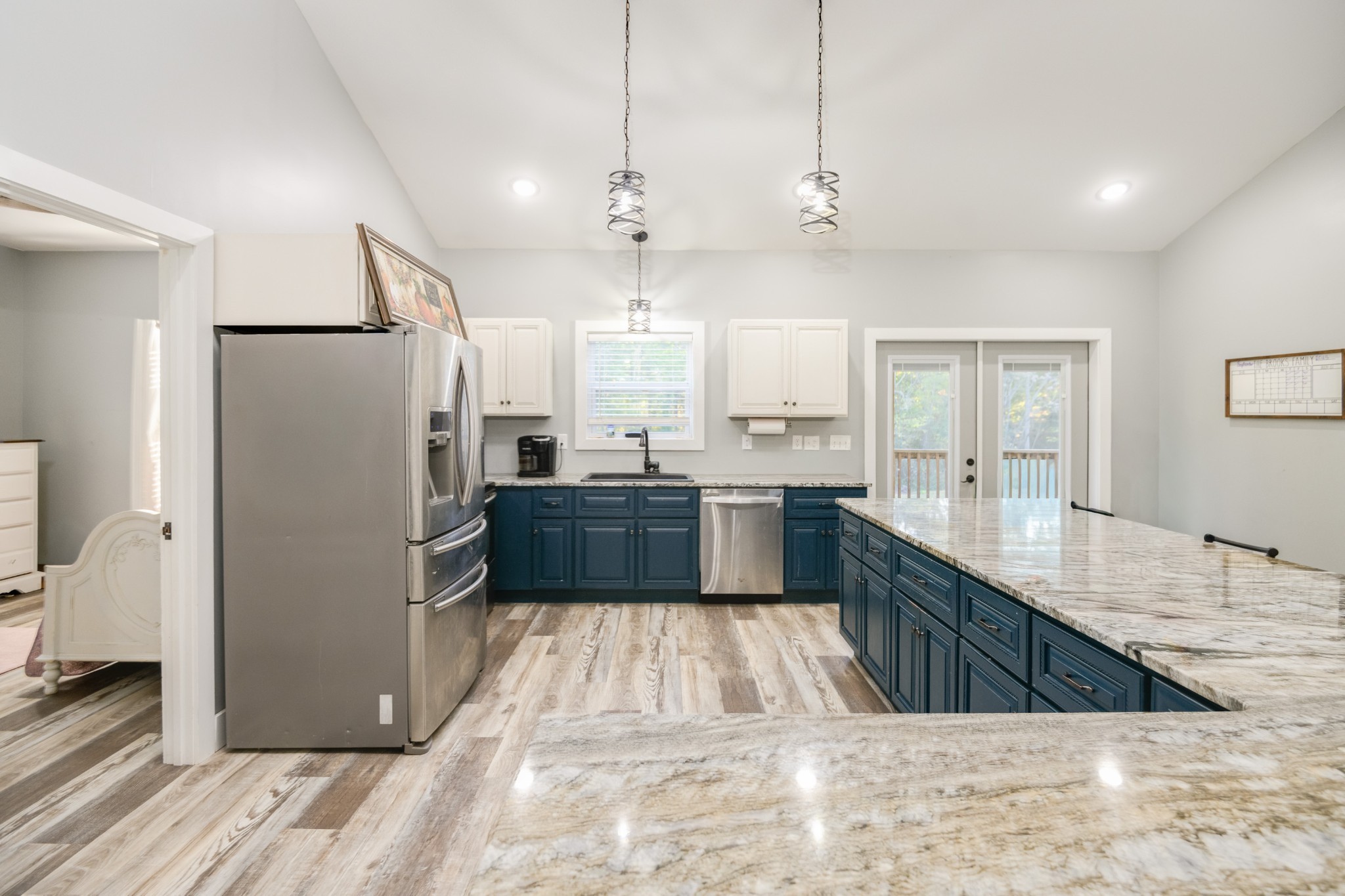 838 Old W Point Road Smithville, TN 37166 - Photo 21 of 65 a large kitchen with kitchen island a sink a counter space stainless steel appliances and cabinets