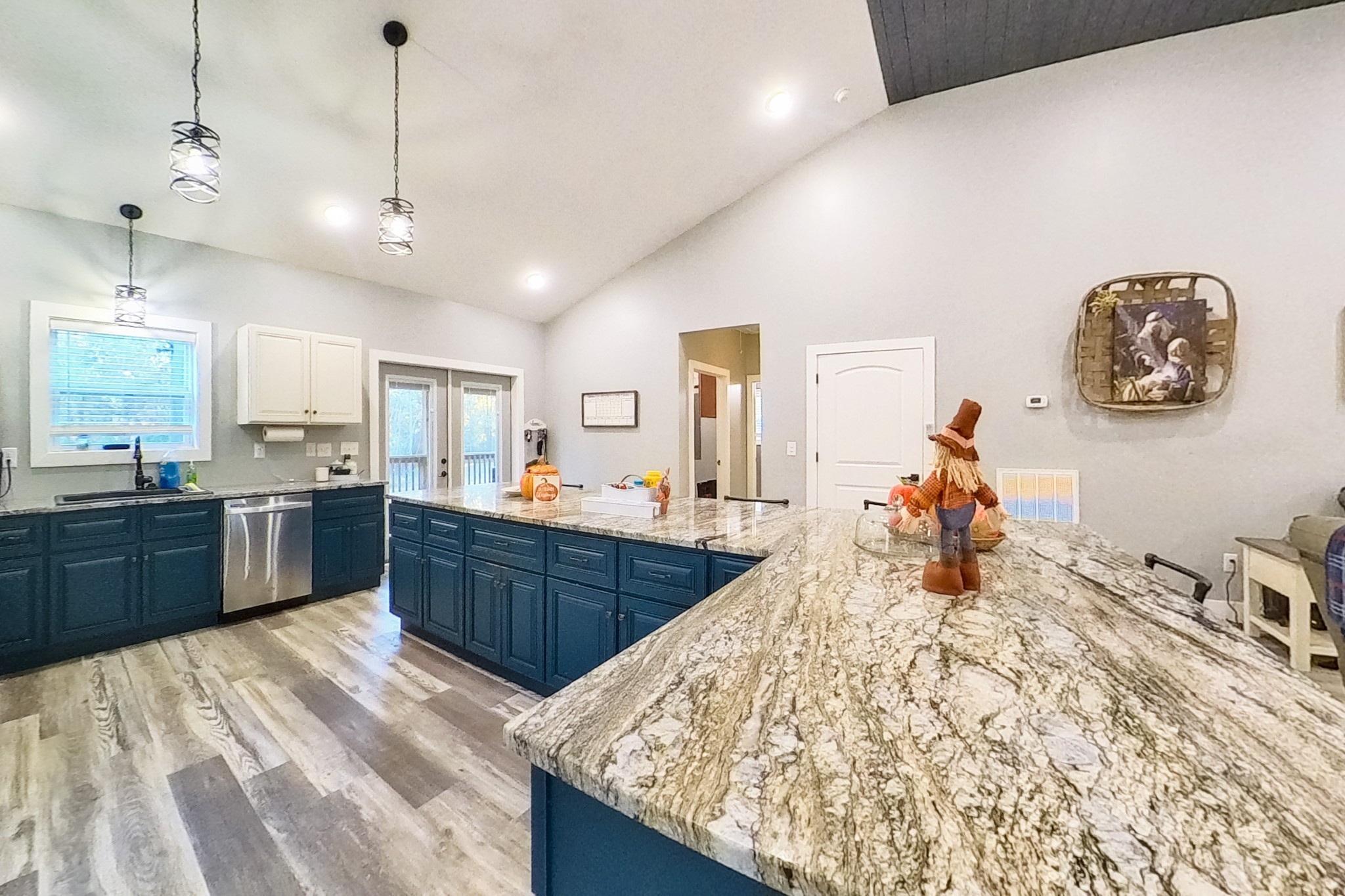 838 Old W Point Road Smithville, TN 37166 - Photo 23 of 65 a large kitchen with kitchen island a stove a sink a counter space and a center island