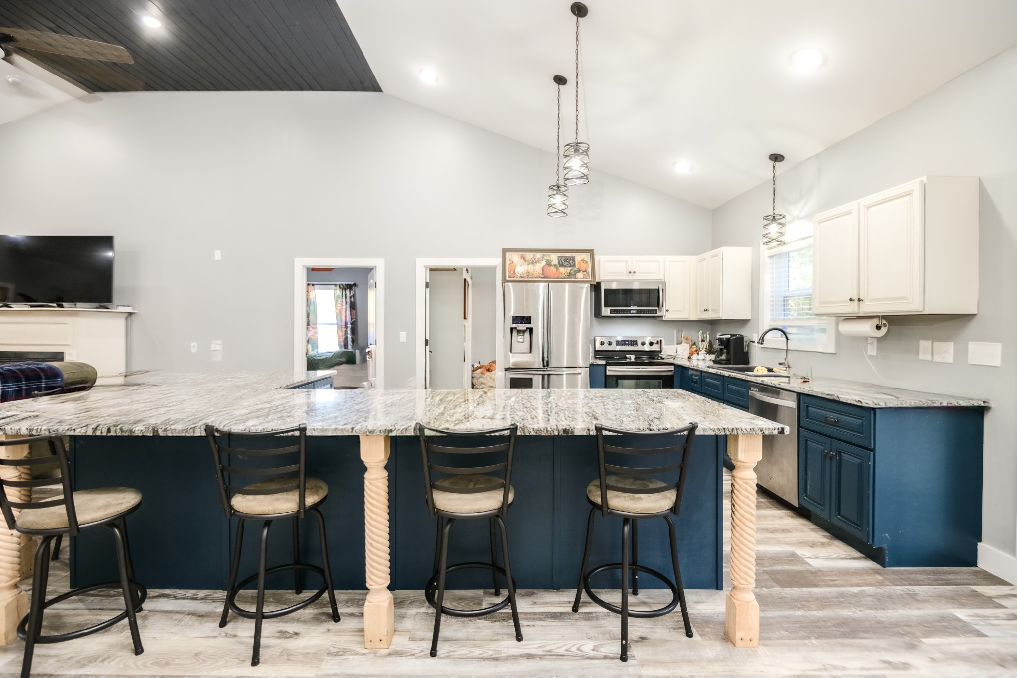 838 Old W Point Road Smithville, TN 37166 - Photo 25 of 65 a kitchen with stainless steel appliances kitchen island granite countertop a table and chairs in it