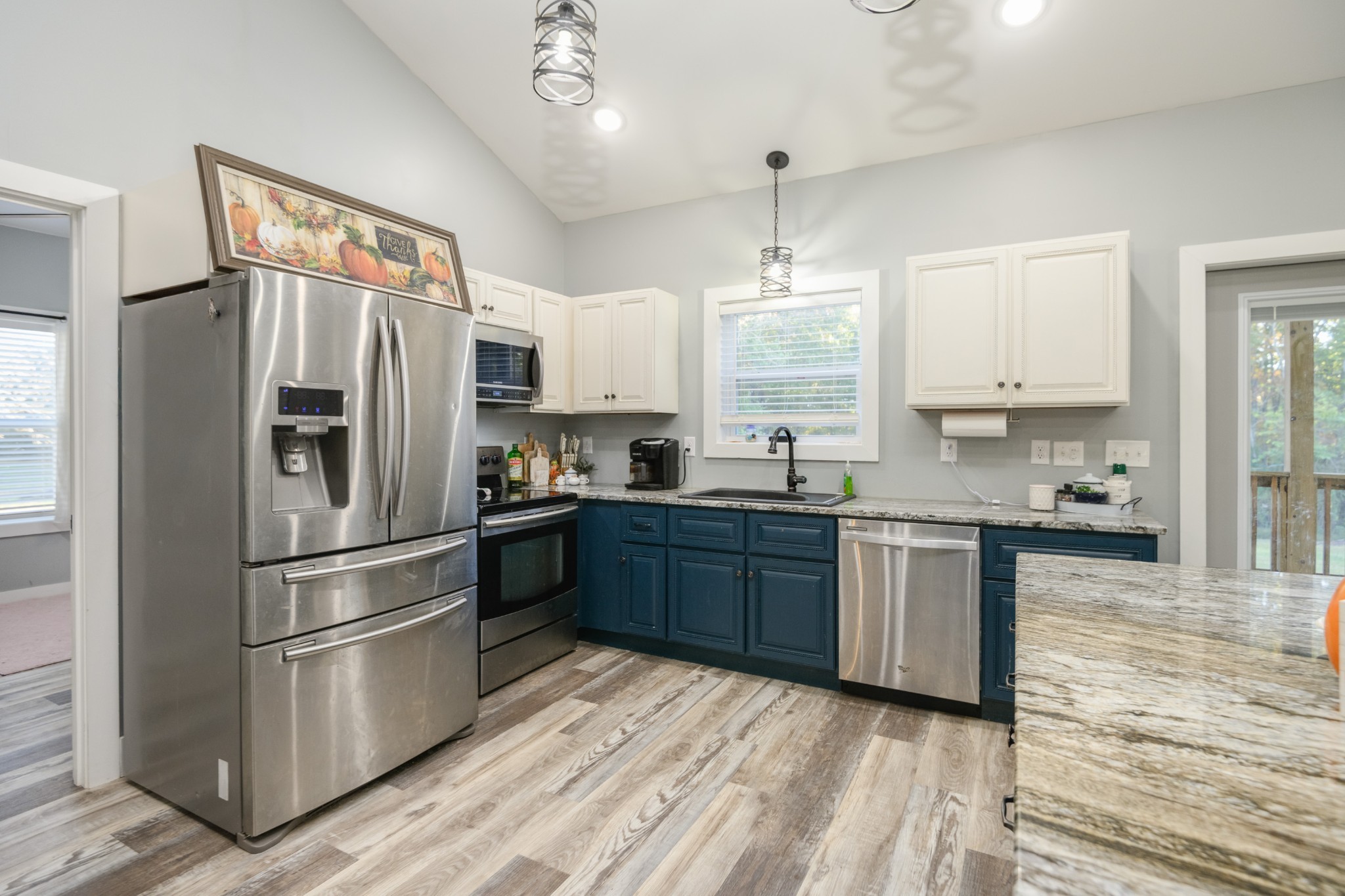 838 Old W Point Road Smithville, TN 37166 - Photo 26 of 65 a kitchen with stainless steel appliances granite countertop a refrigerator a stove a sink and a microwave
