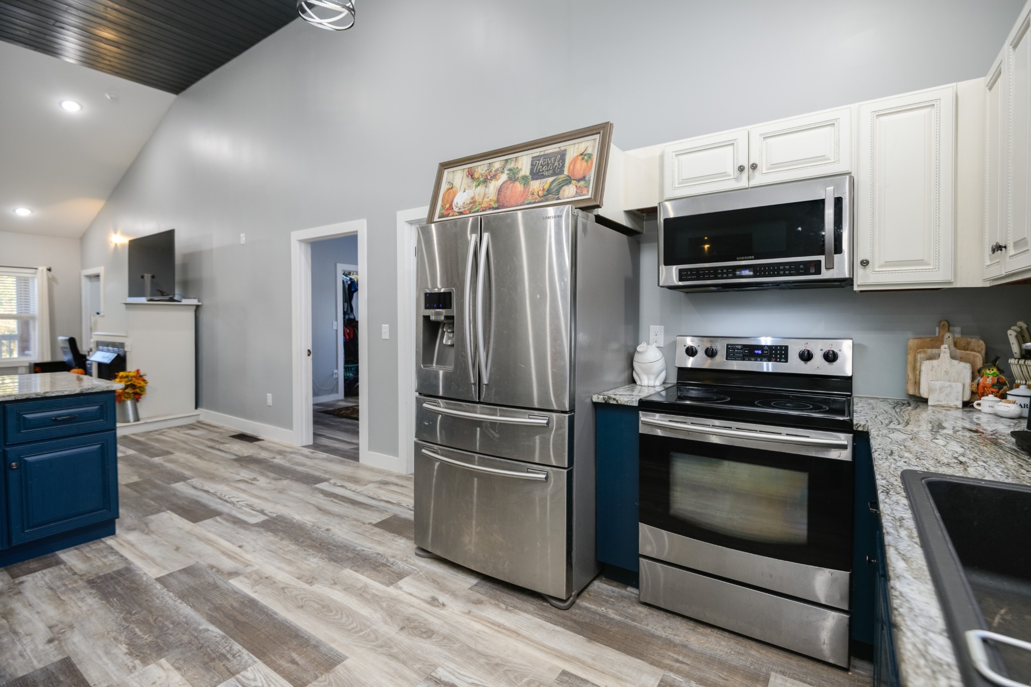 838 Old W Point Road Smithville, TN 37166 - Photo 28 of 65 a kitchen with stainless steel appliances a stove a microwave and a refrigerator