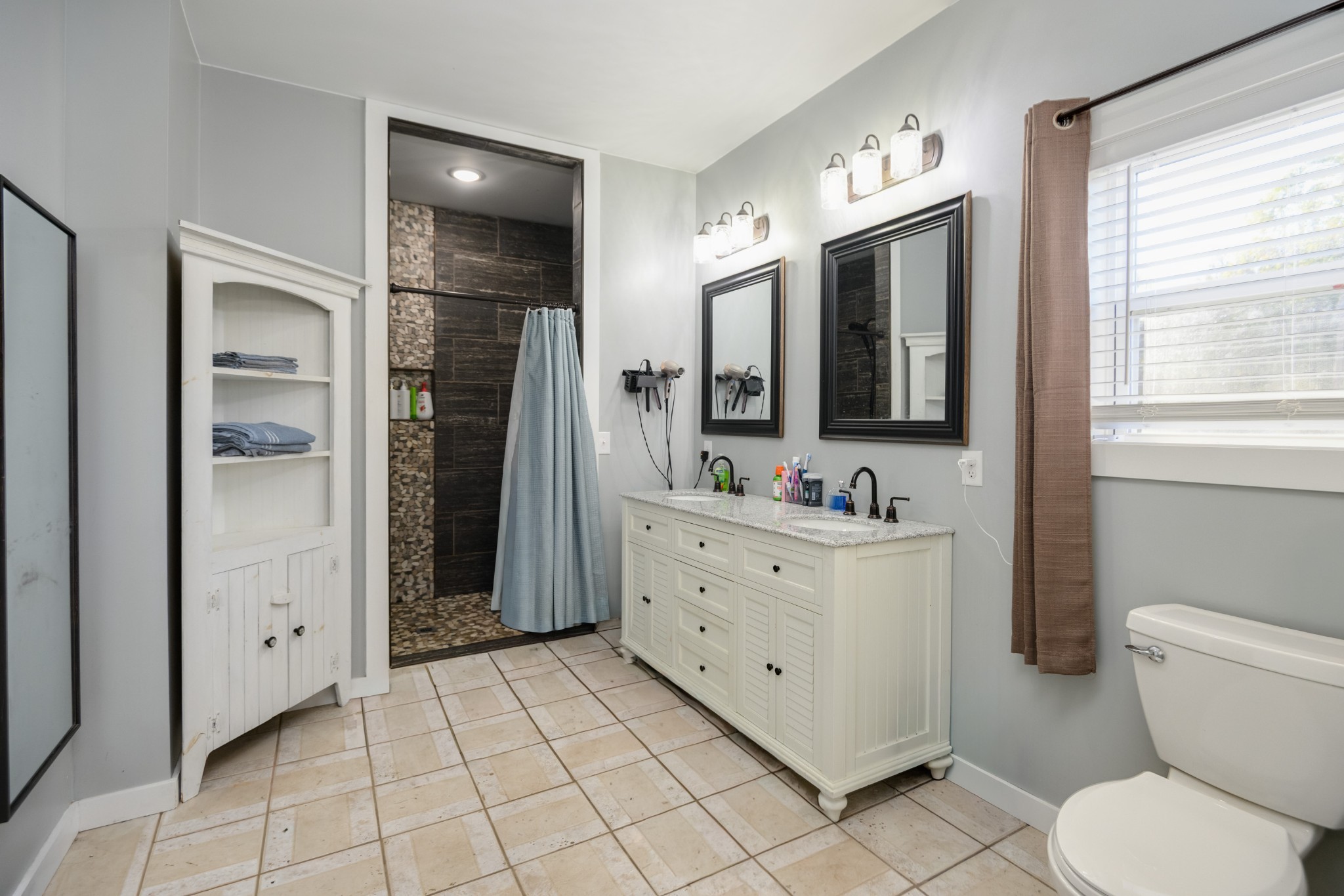 838 Old W Point Road Smithville, TN 37166 - Photo 35 of 65 a bathroom with a sink a toilet and mirror