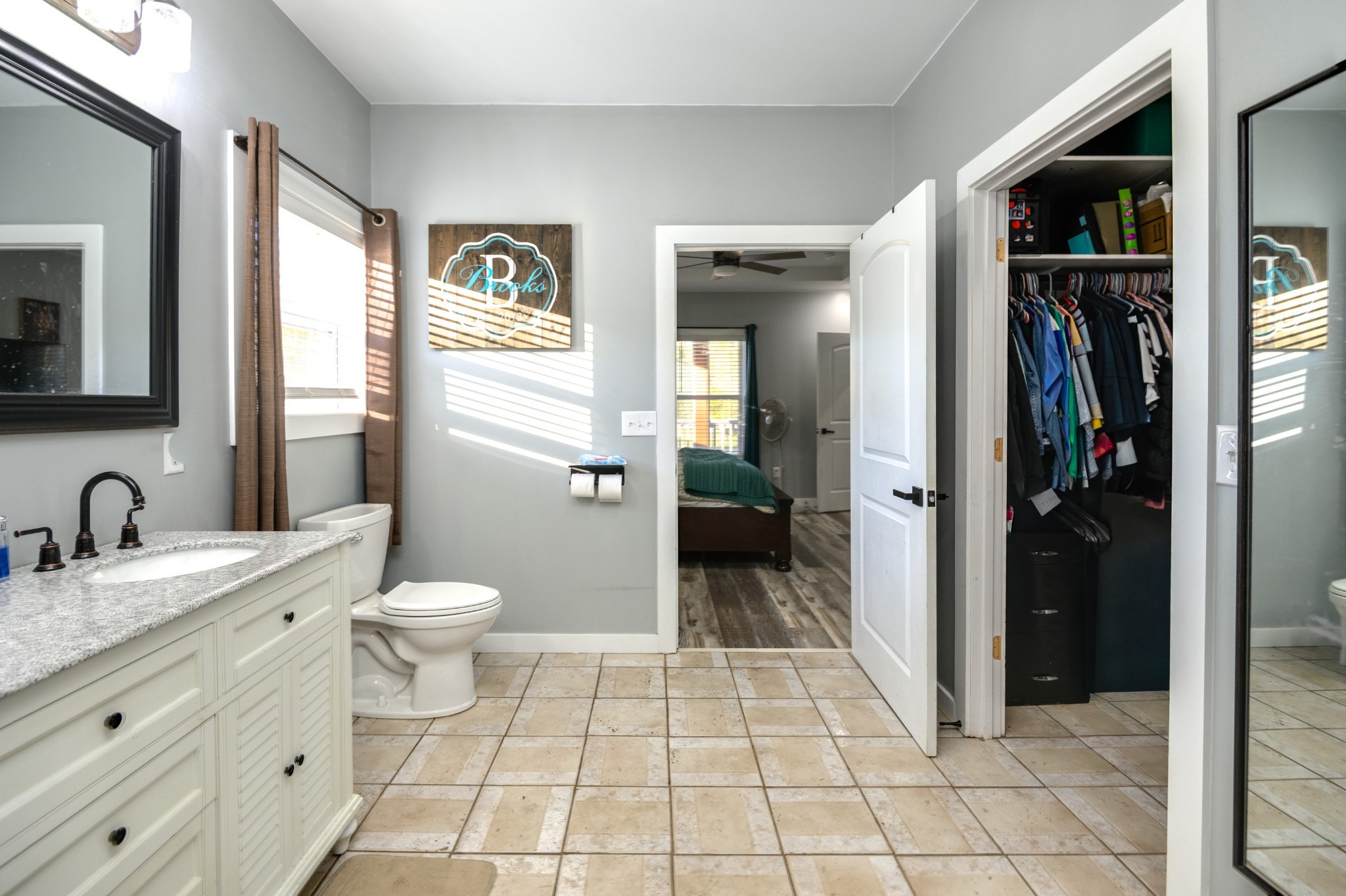 838 Old W Point Road Smithville, TN 37166 - Photo 36 of 65 a bathroom with a granite countertop sink a toilet and a mirror