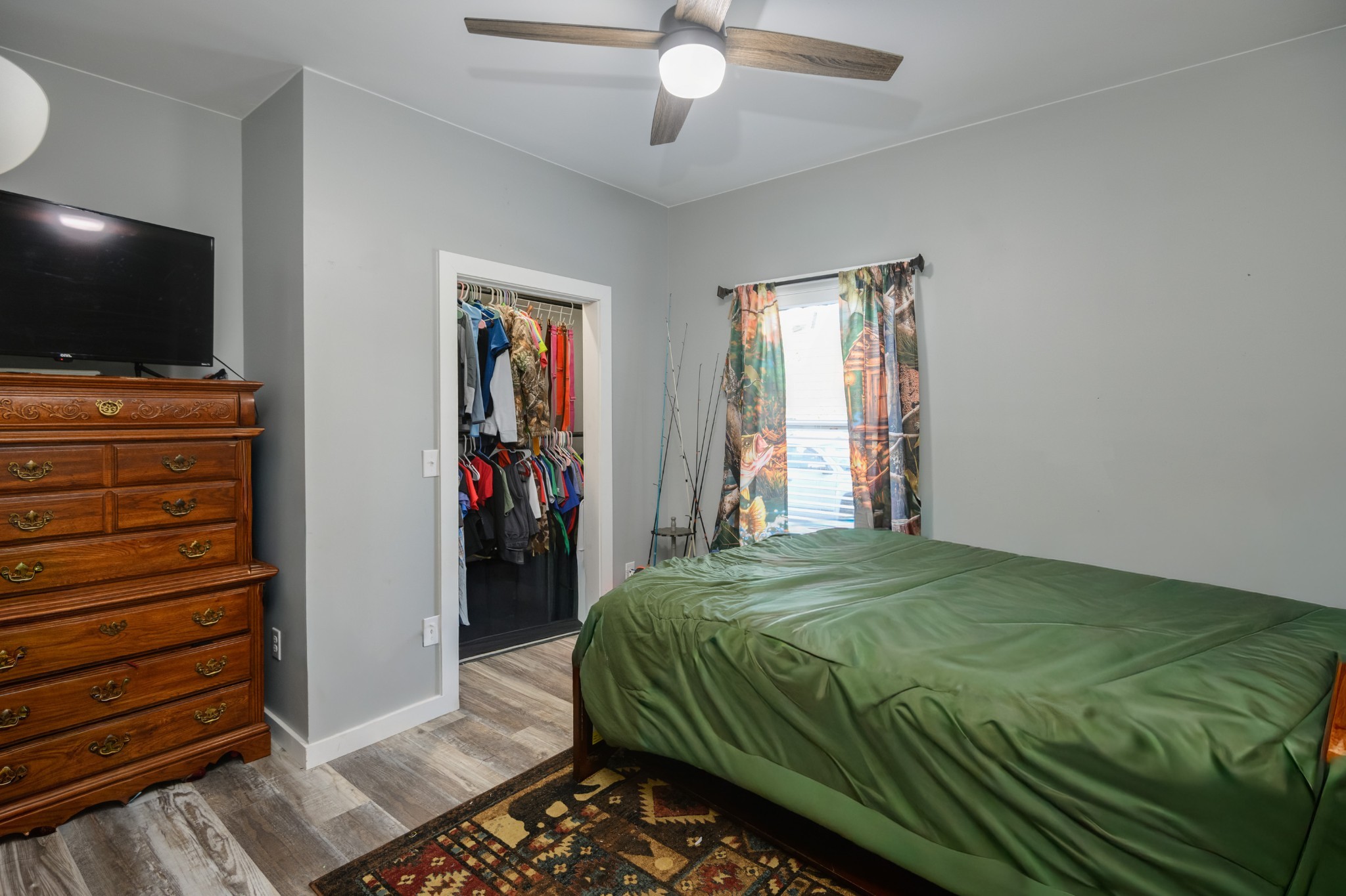 838 Old W Point Road Smithville, TN 37166 - Photo 42 of 65 a bedroom with a bed and a flat screen tv