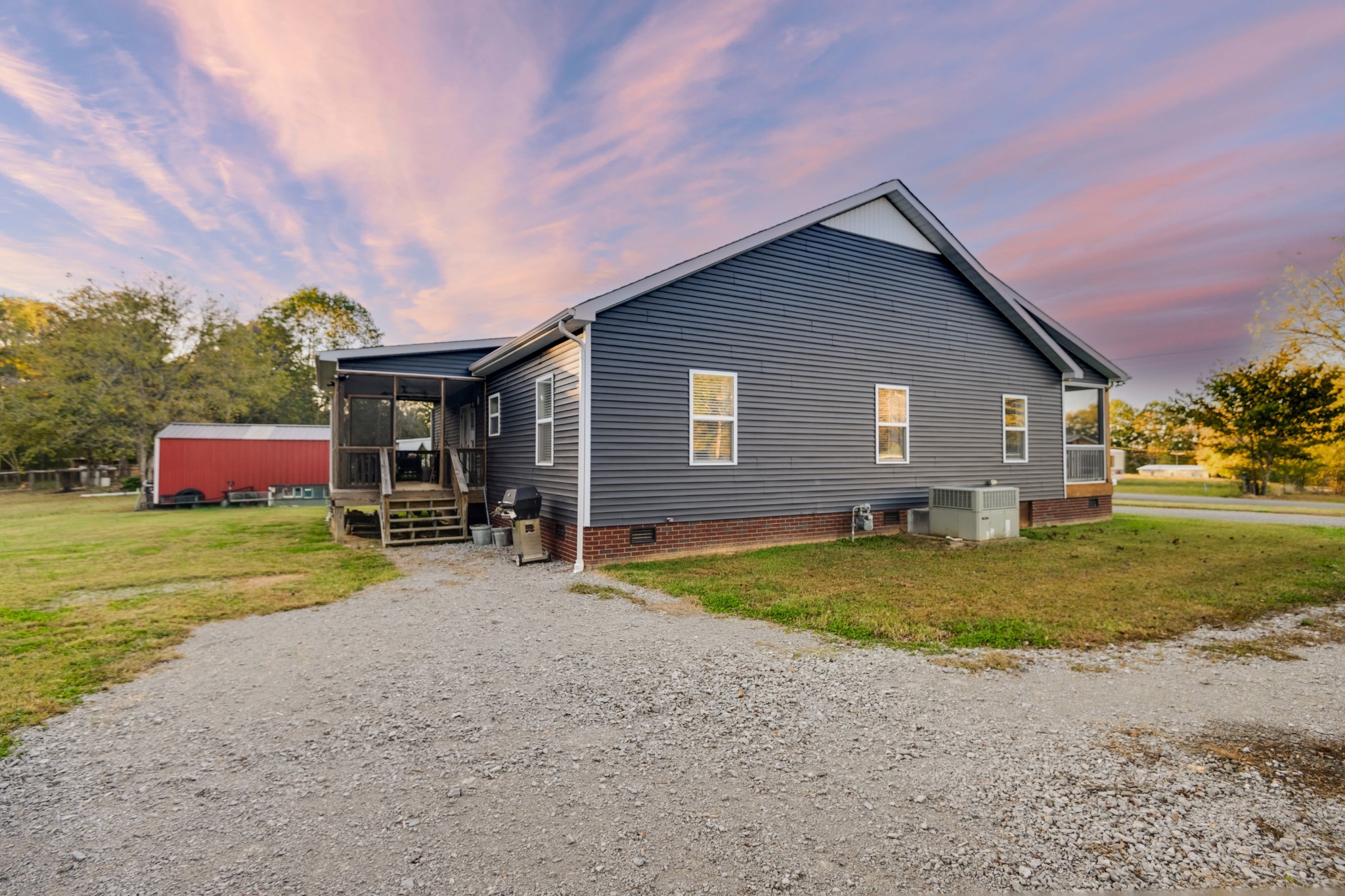 838 Old W Point Road Smithville, TN 37166 - Photo 8 of 65 a front view of a house with a yard and garage