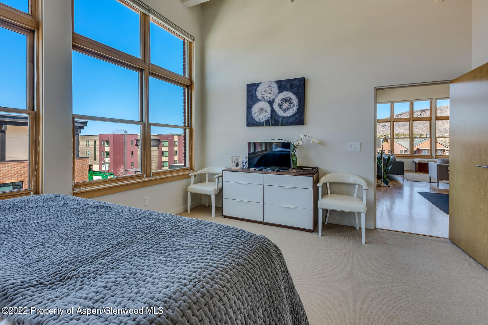 231 Robinson Street, Unit 312 Basalt, CO 81621 - Photo 11 of 25 a bedroom with a large bed and a window