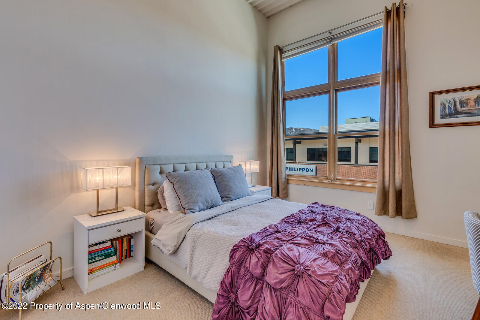 231 Robinson Street, Unit 312 Basalt, CO 81621 - Photo 13 of 25 a bedroom with a large bed and a large window