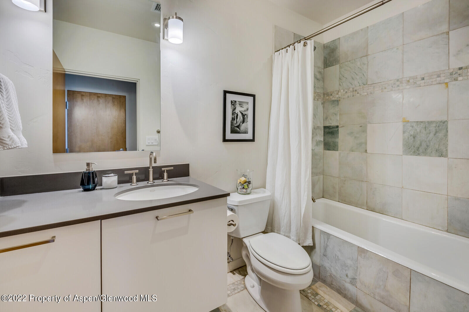 231 Robinson Street, Unit 312 Basalt, CO 81621 - Photo 15 of 25 a bathroom with a granite countertop sink toilet and shower