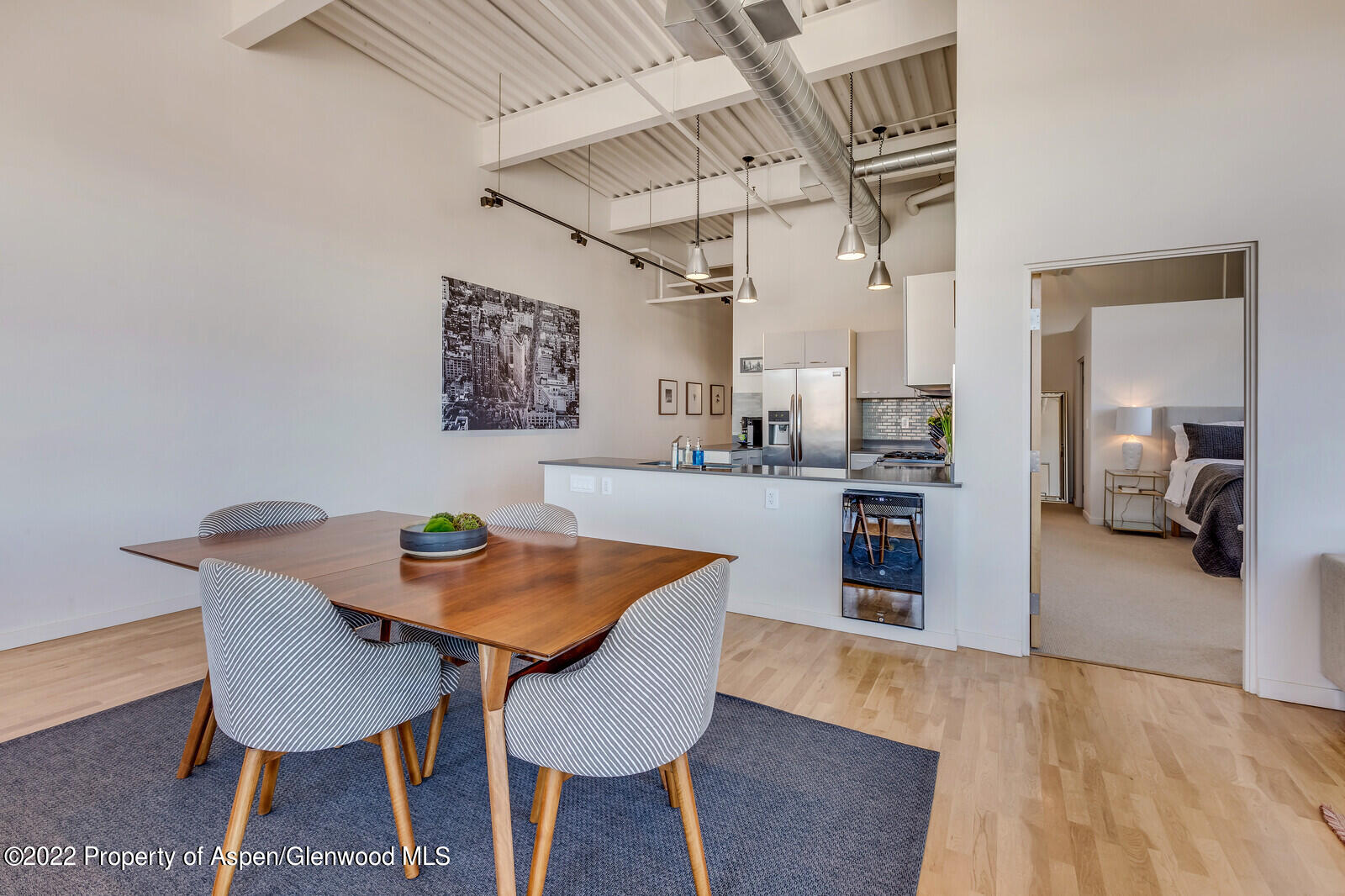 231 Robinson Street, Unit 312 Basalt, CO 81621 - Photo 6 of 25 a view of a dining room with furniture and wooden floor
