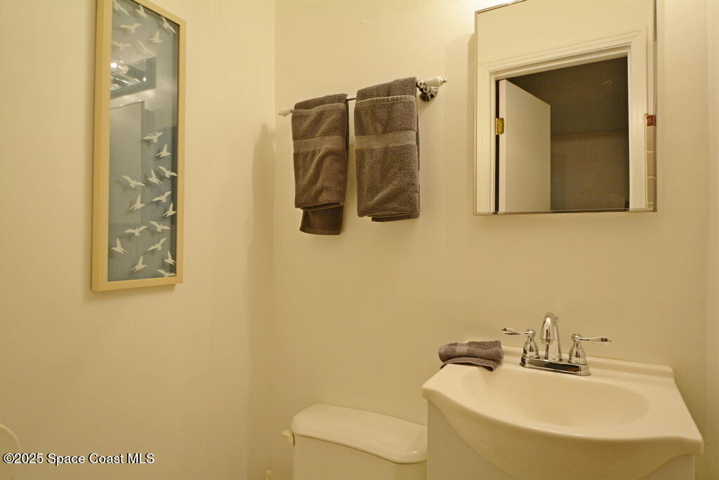 15 Hardee Circle South Rockledge, FL 32955 - Photo 20 of 44 a bathroom with a sink and a mirror