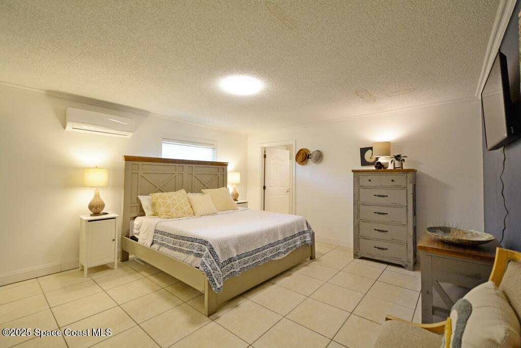 15 Hardee Circle South Rockledge, FL 32955 - Photo 23 of 44 a bedroom with a bed and a cabinets