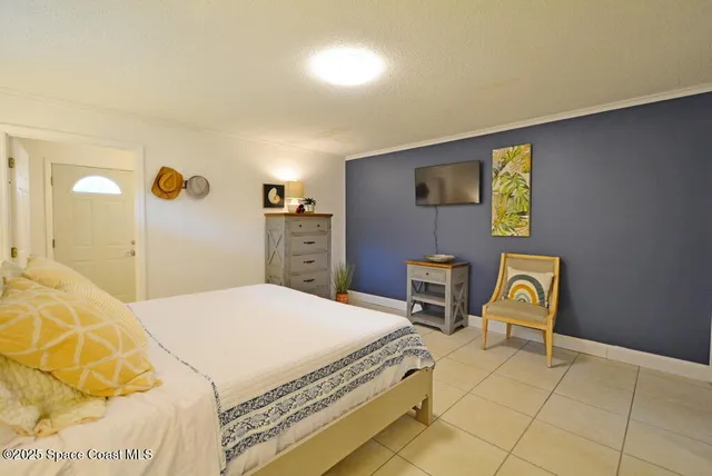 a bedroom with a bed and a cabinets