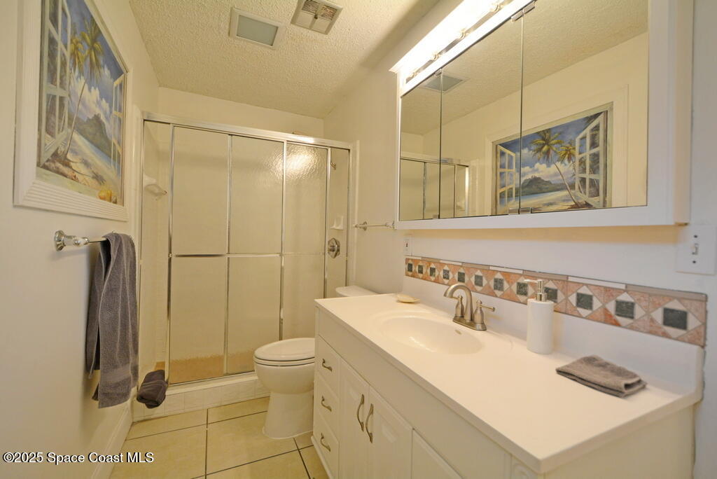 15 Hardee Circle South Rockledge, FL 32955 - Photo 25 of 44 a bathroom with a sink a toilet and shower