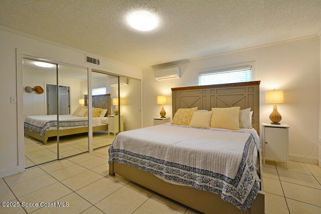 15 Hardee Circle South Rockledge, FL 32955 - Photo 27 of 44 a bedroom with a bed and a view of living room