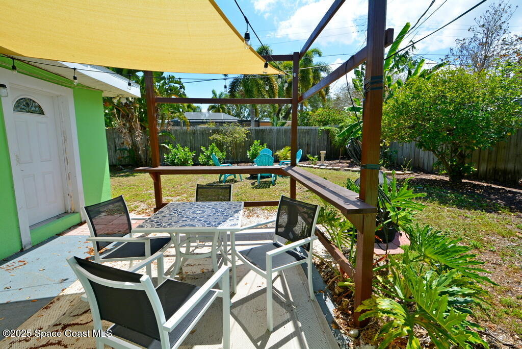 15 Hardee Circle South Rockledge, FL 32955 - Photo 29 of 44 a view of an outdoor sitting area with furniture and wooden floor