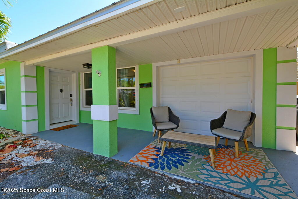 15 Hardee Circle South Rockledge, FL 32955 - Photo 36 of 44 a balcony with chairs and a table