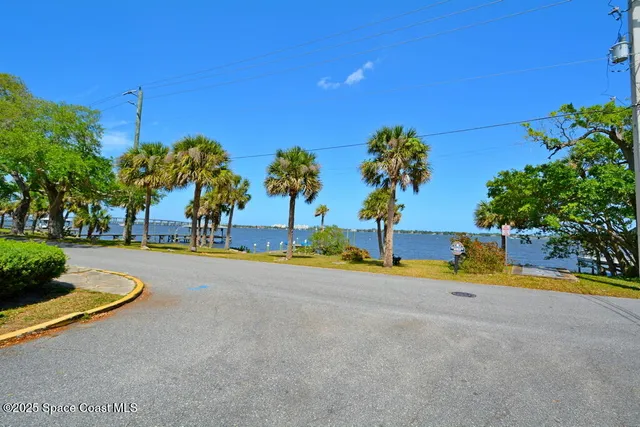 a view of a street with houses on both side