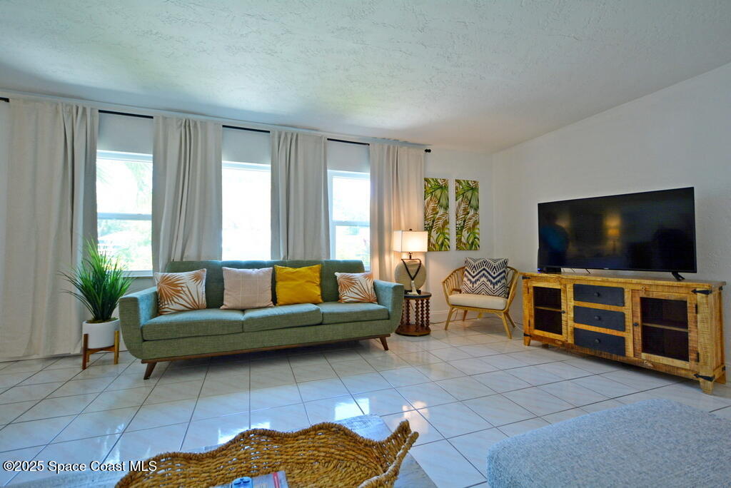 15 Hardee Circle South Rockledge, FL 32955 - Photo 6 of 44 a living room with furniture and a flat screen tv