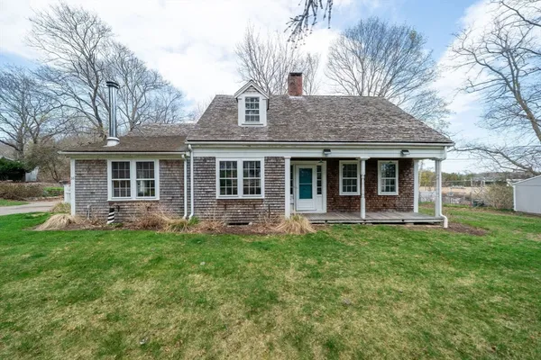 front view of a house with a yard