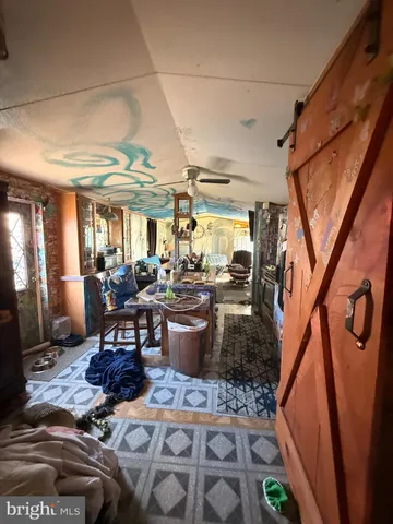 a living room with lots of furniture and black furniture