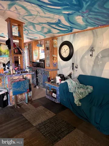 a living room with furniture and a clock