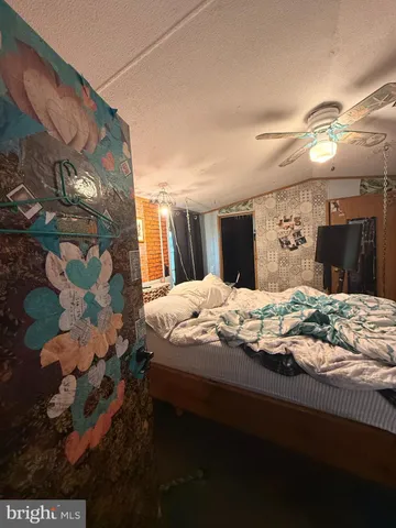 a bedroom with a bed and a mirror