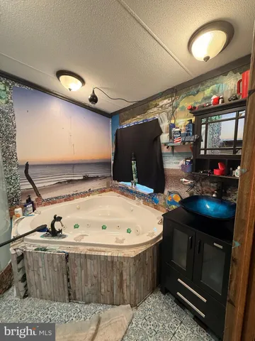 a living room with fireplace furniture and a flat screen tv