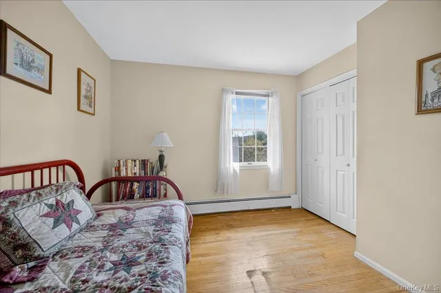 a bathroom with a sink and mirror with toilet