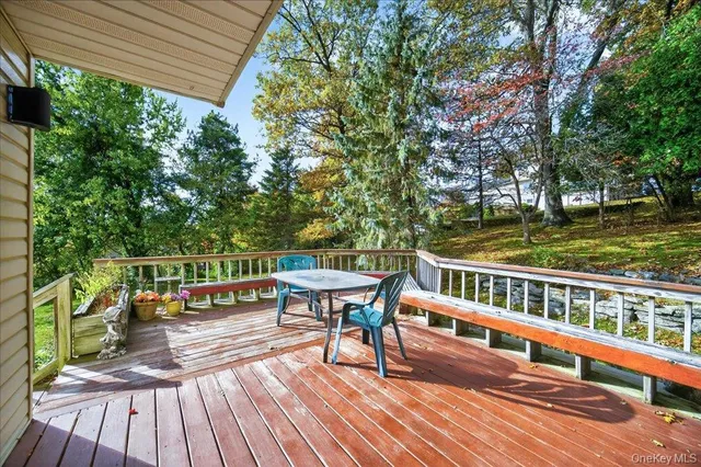 a view of balcony with wooden floor