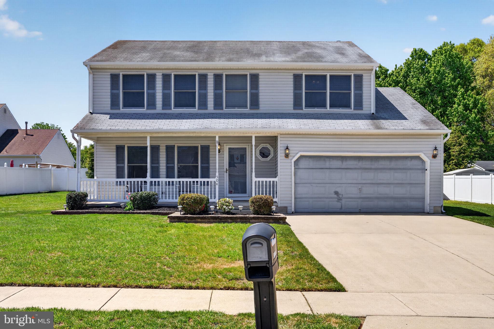 504 Ash Street Glassboro, NJ 08028 - Photo 1 of 42 a front view of a house with a yard and garage