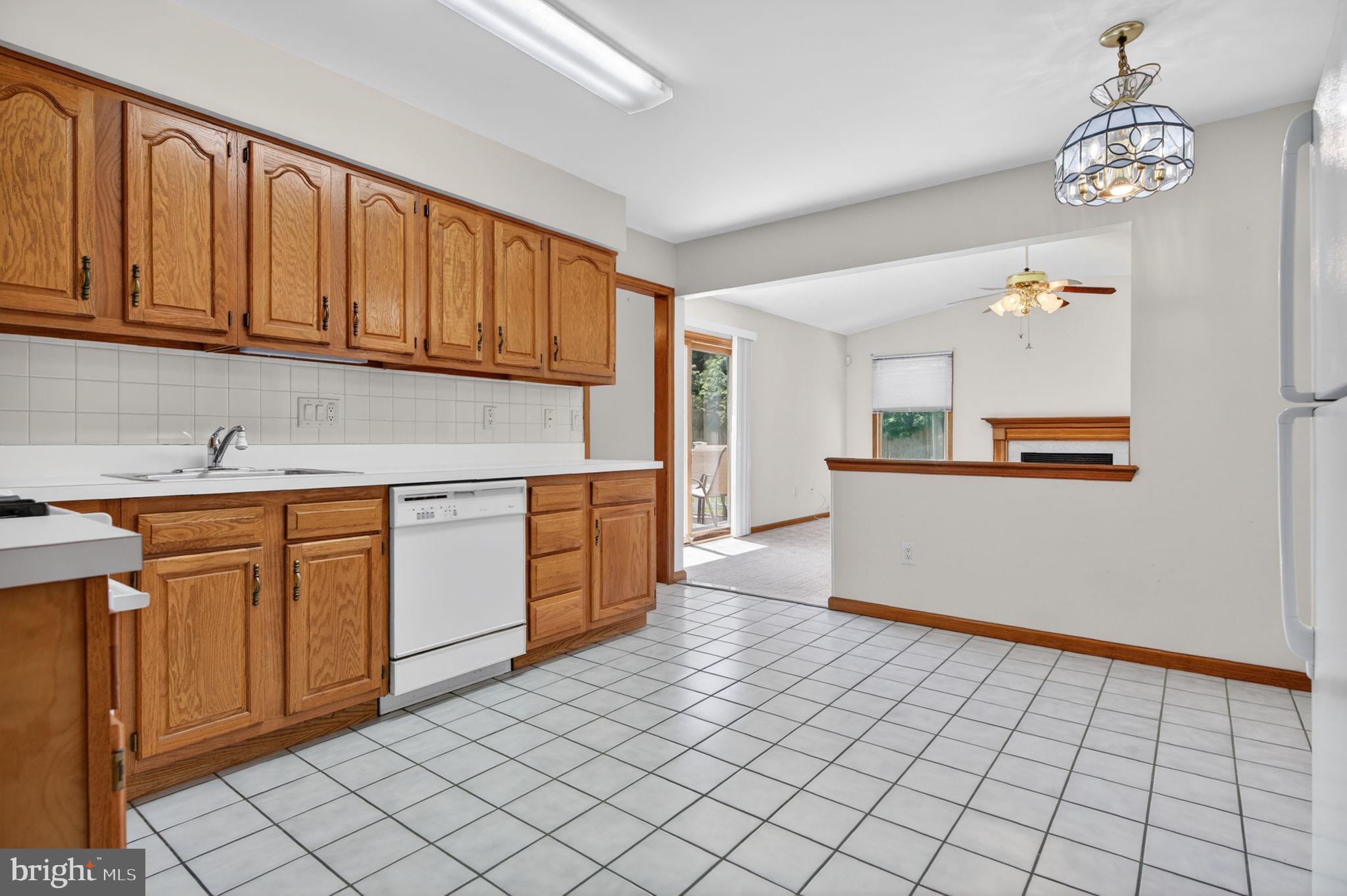 504 Ash Street Glassboro, NJ 08028 - Photo 12 of 42 a kitchen with stainless steel appliances granite countertop a refrigerator sink and cabinets