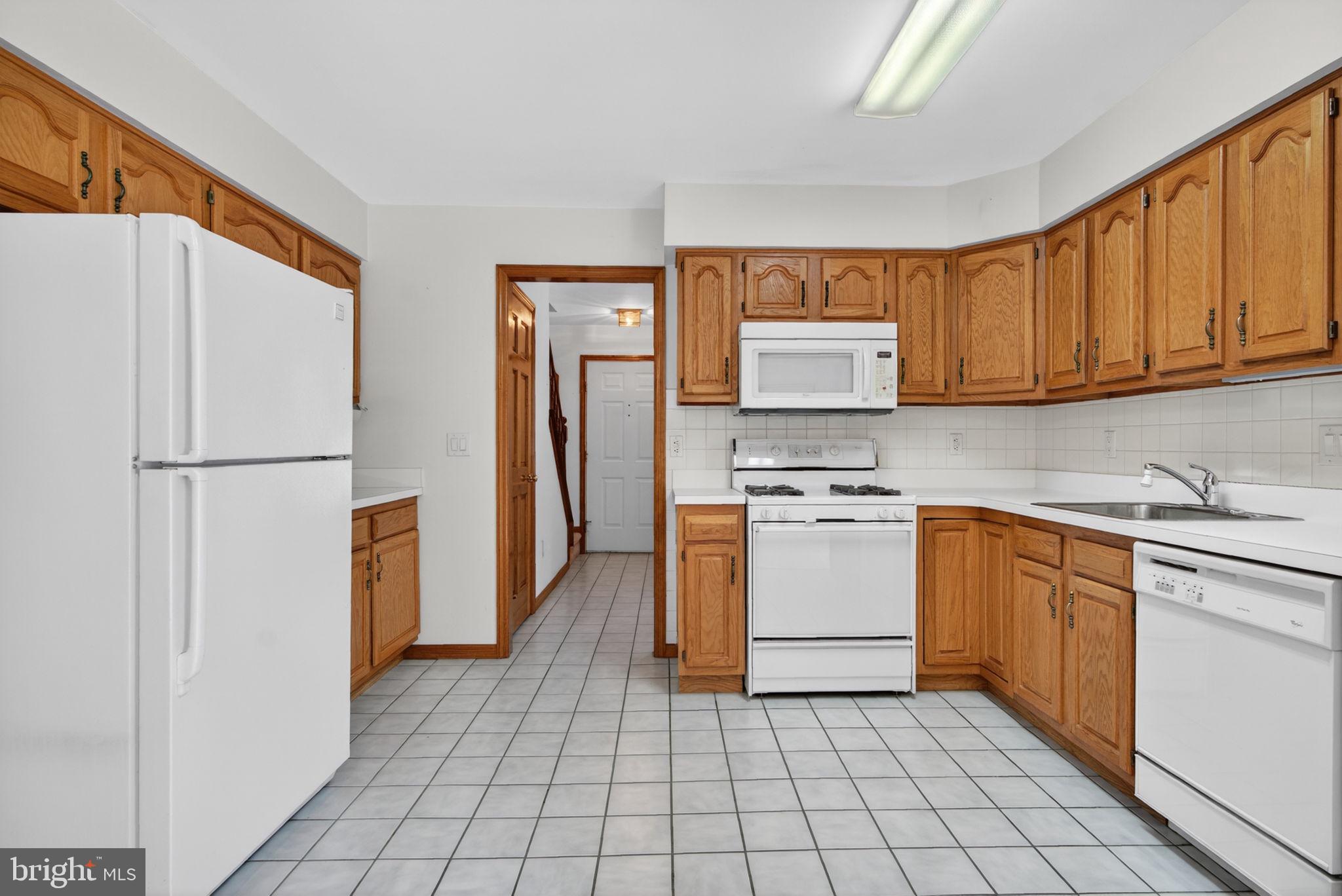 504 Ash Street Glassboro, NJ 08028 - Photo 15 of 42 a kitchen with stainless steel appliances granite countertop a refrigerator sink and stove