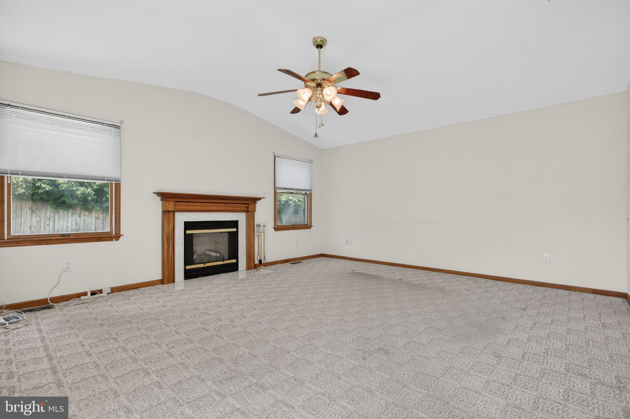 504 Ash Street Glassboro, NJ 08028 - Photo 16 of 42 an empty room with chandelier fan and windows